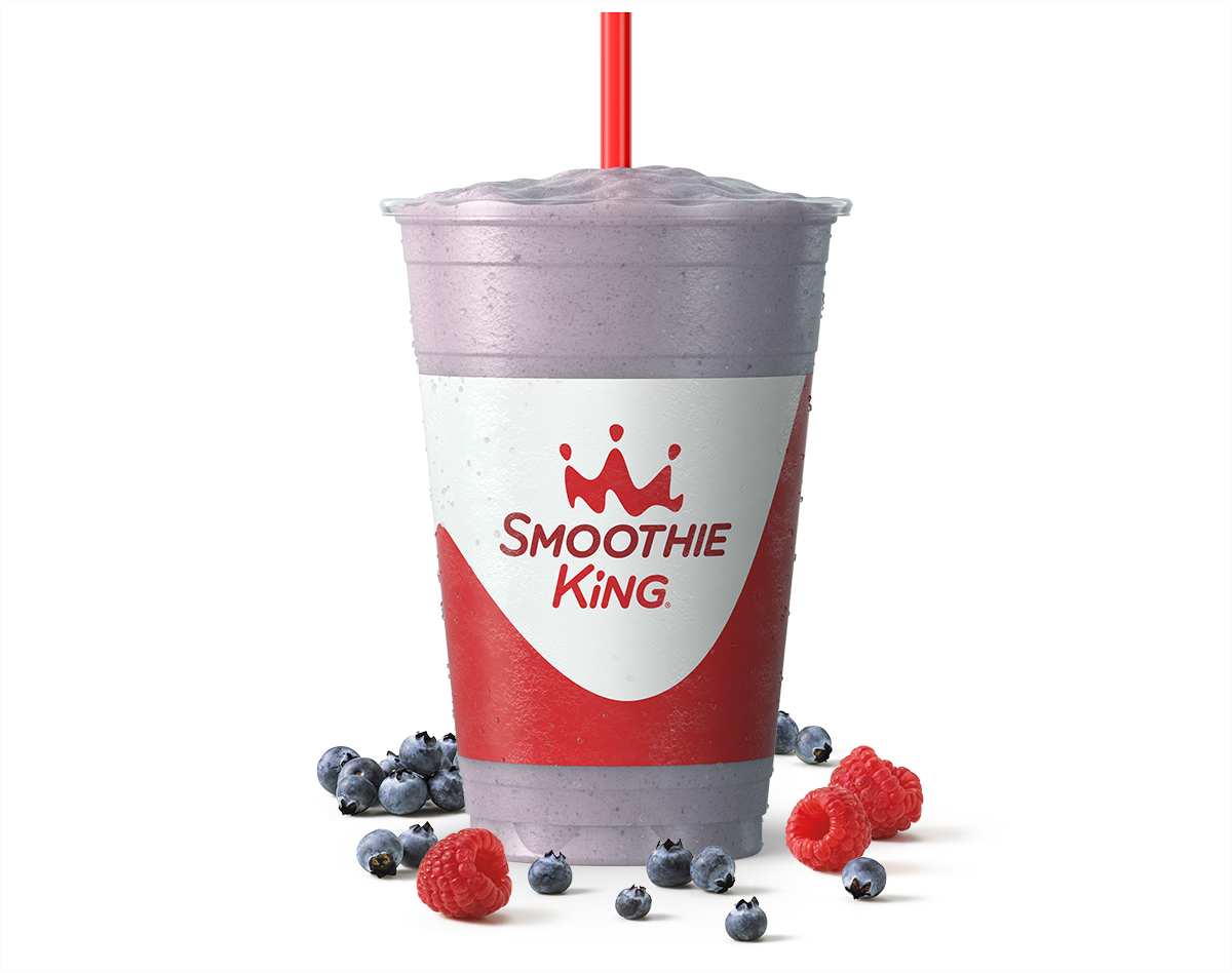 Purple smoothie from Smoothie King with real fruit beside it